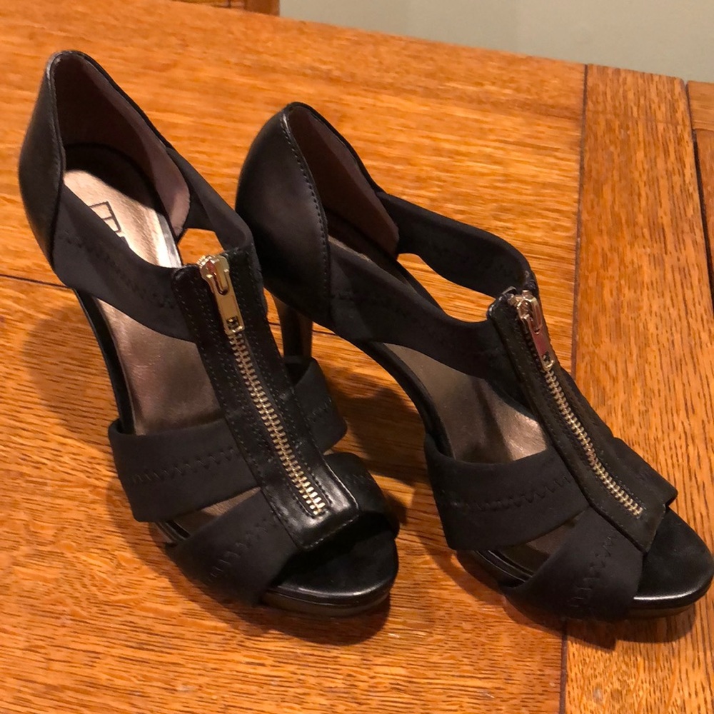 Black open toe heels with a brass colored zipper